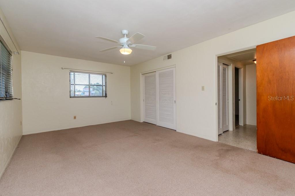 LARGE PRIMARY BEDROOM WITH BUILT IN CLOSETS