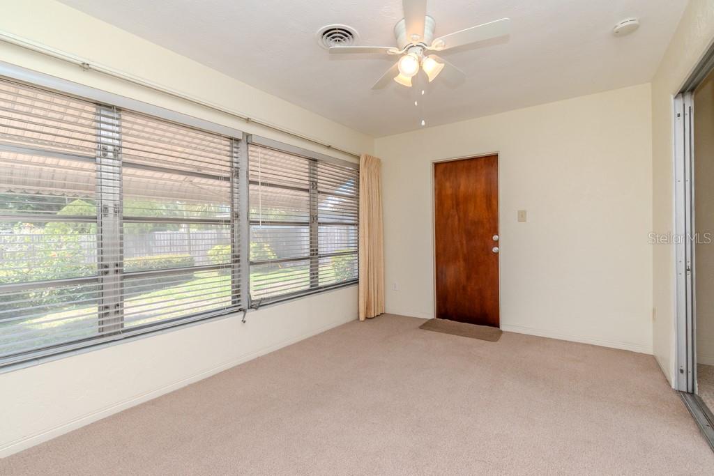 FLORIDA ROOM - DOOR EXITS INTO THE GARAGE