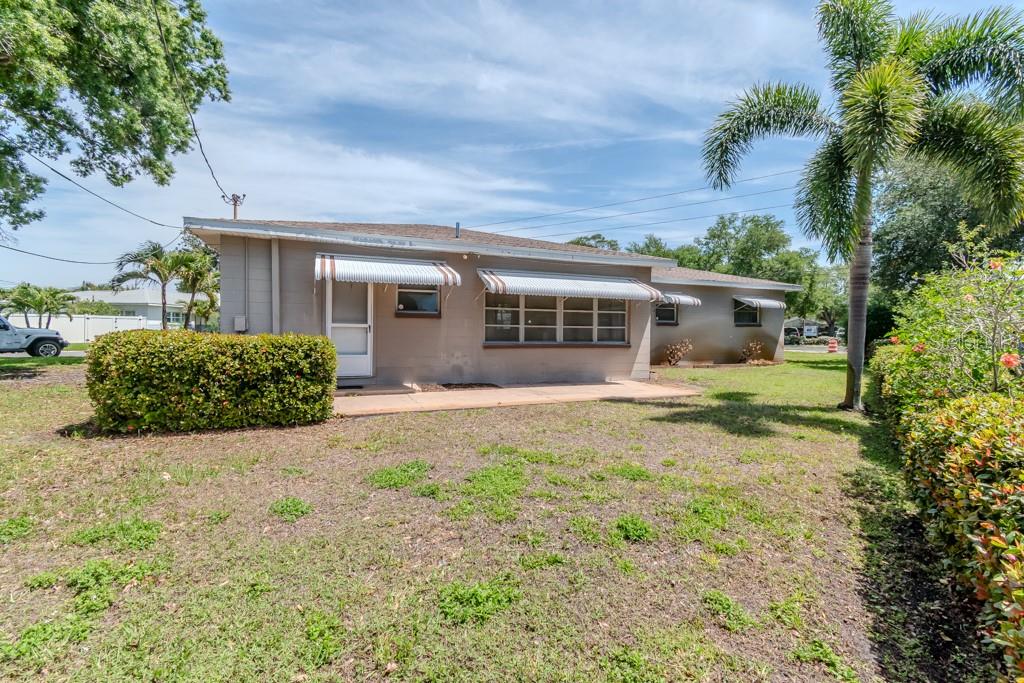 BACK YARD - FLORIDA ROOM - WITH WINDOW AWNINGS