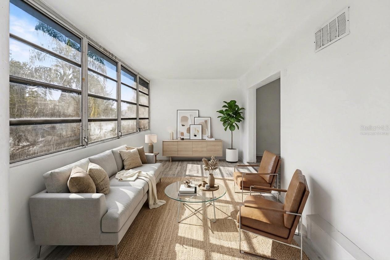 Virtually Staged- Flex room filled with natural light, can be used as a reading area, an office or a hobby space