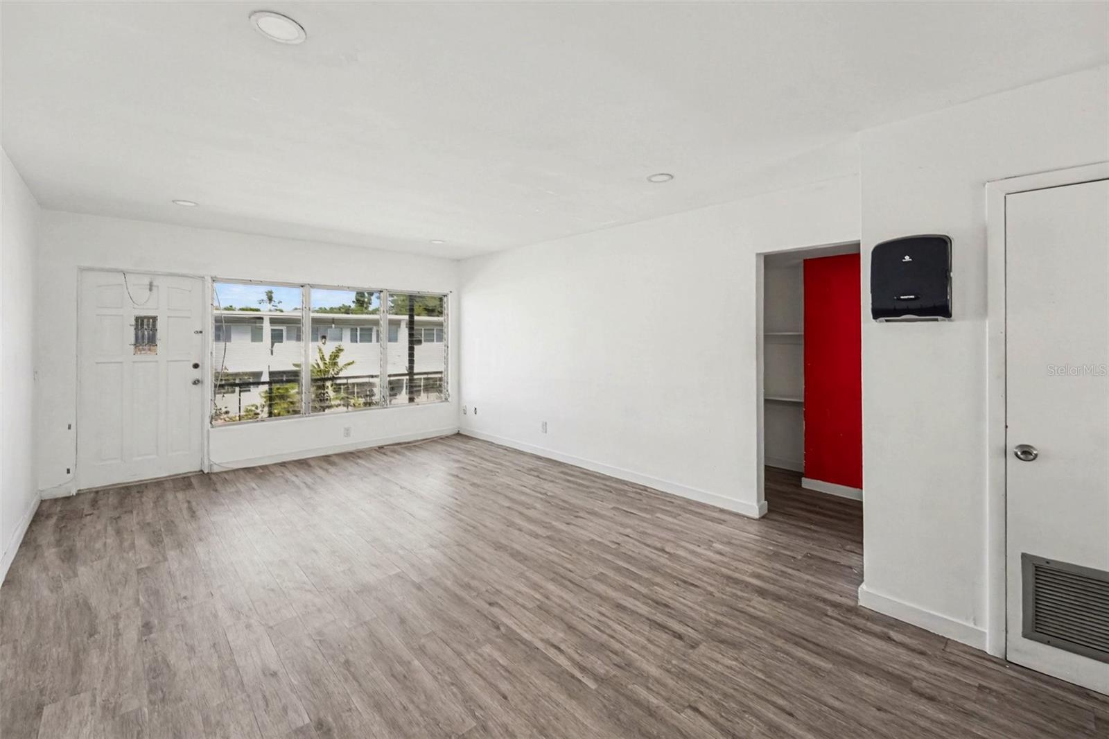 The kitchen features granite countertop, tile backsplash, new custom cabinets and stainlessnsteel appliances