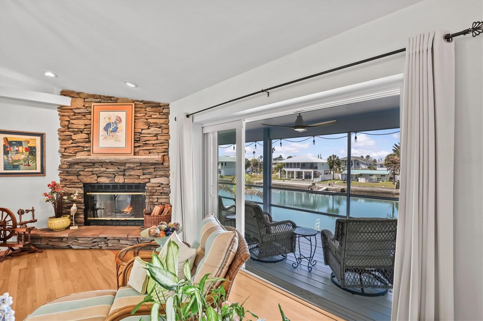 Living Room with Stone Wood-Burning Fireplace
