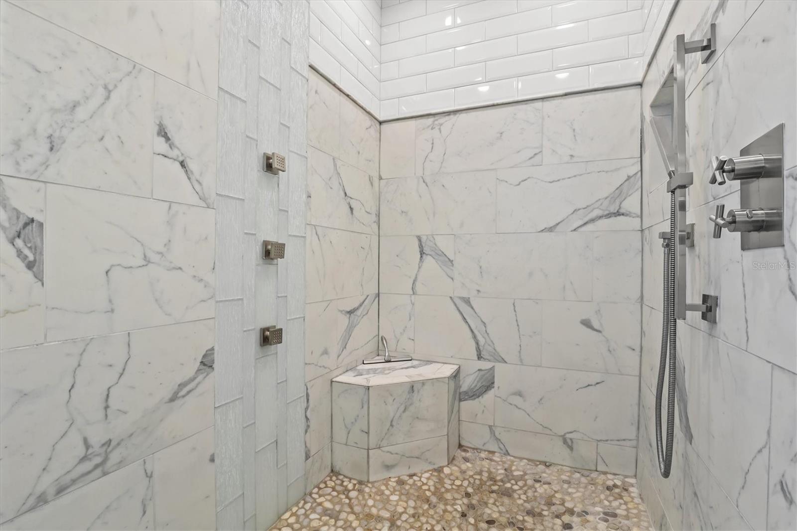 Large Walk-in Shower in Primary Bathroom with Seat