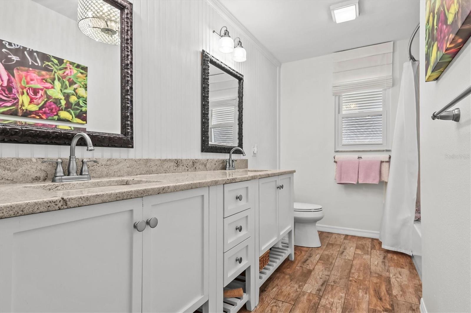 Coastal Looking Second Bathroom with Dual Sinks