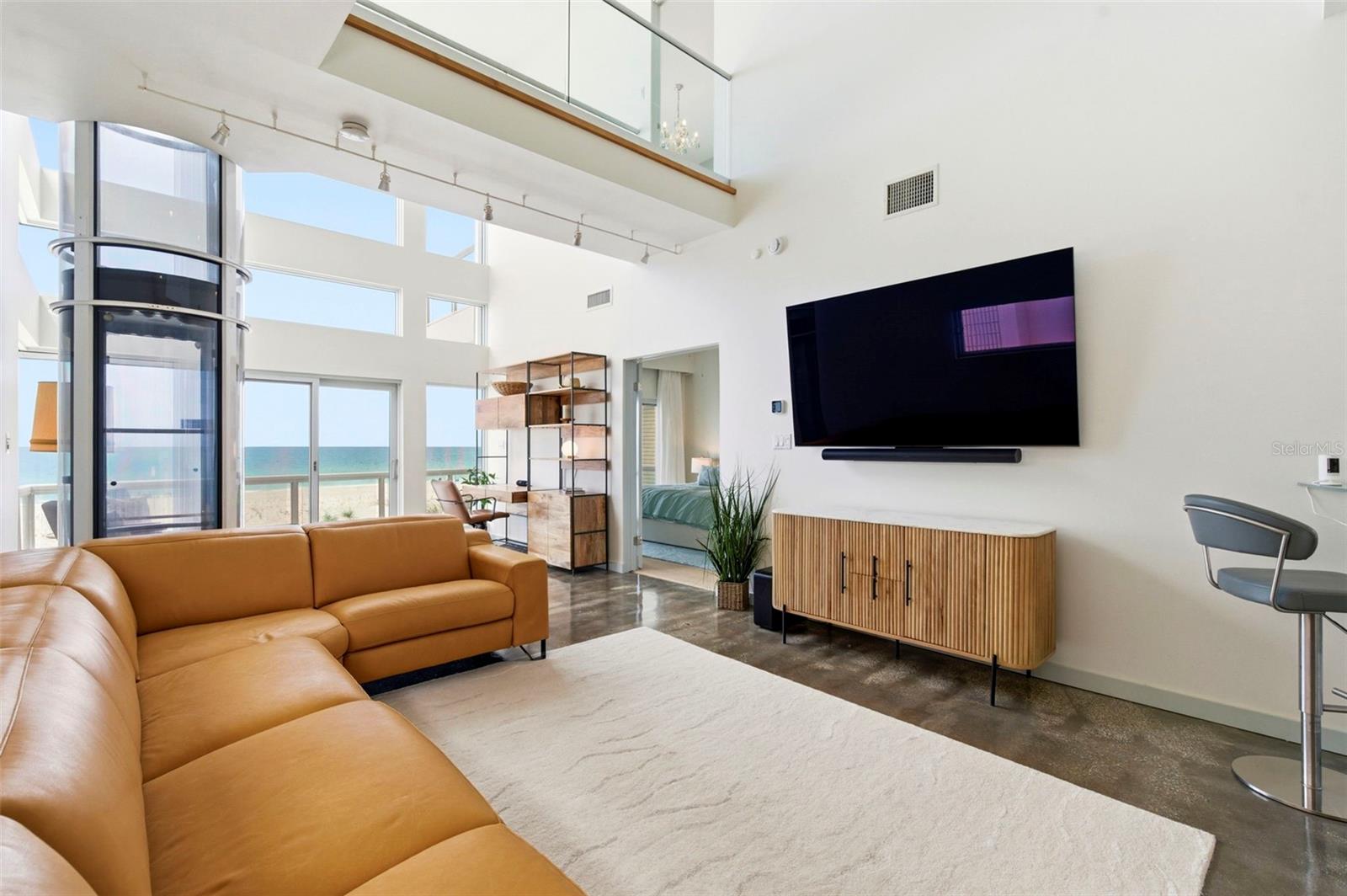 2 Story Living Room With Glass Elevator