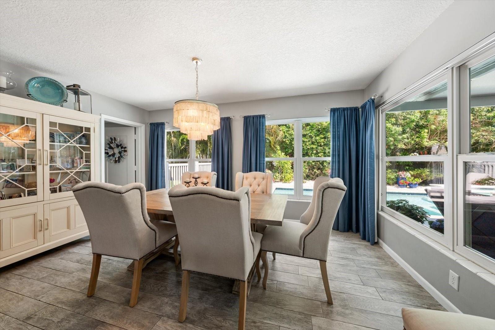 Dining space with a view of the pool
