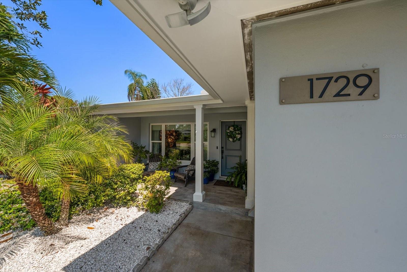 Address number, walkway, front door & patio Space