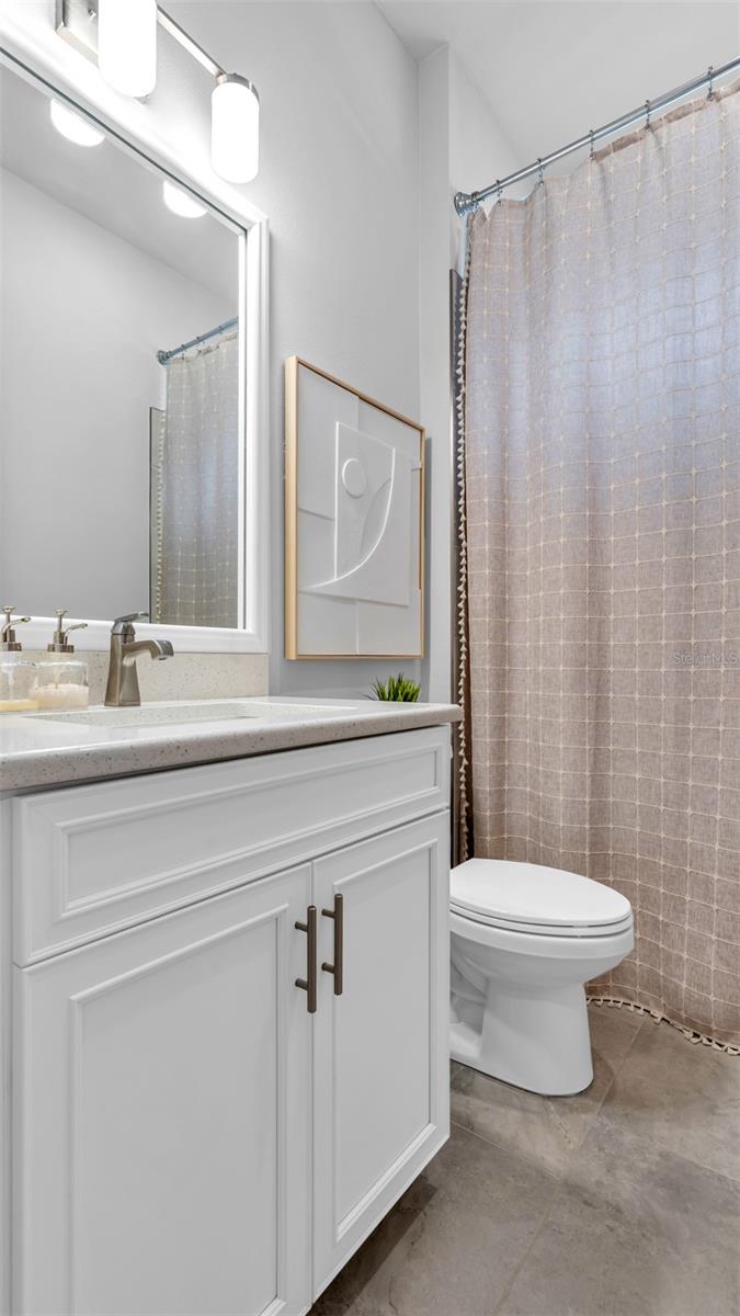 Bathroom with tub. This bathroom is between two bedrooms toward the front of the house.