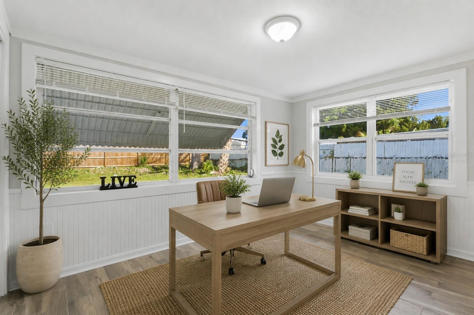 Virtually staged as a home office.