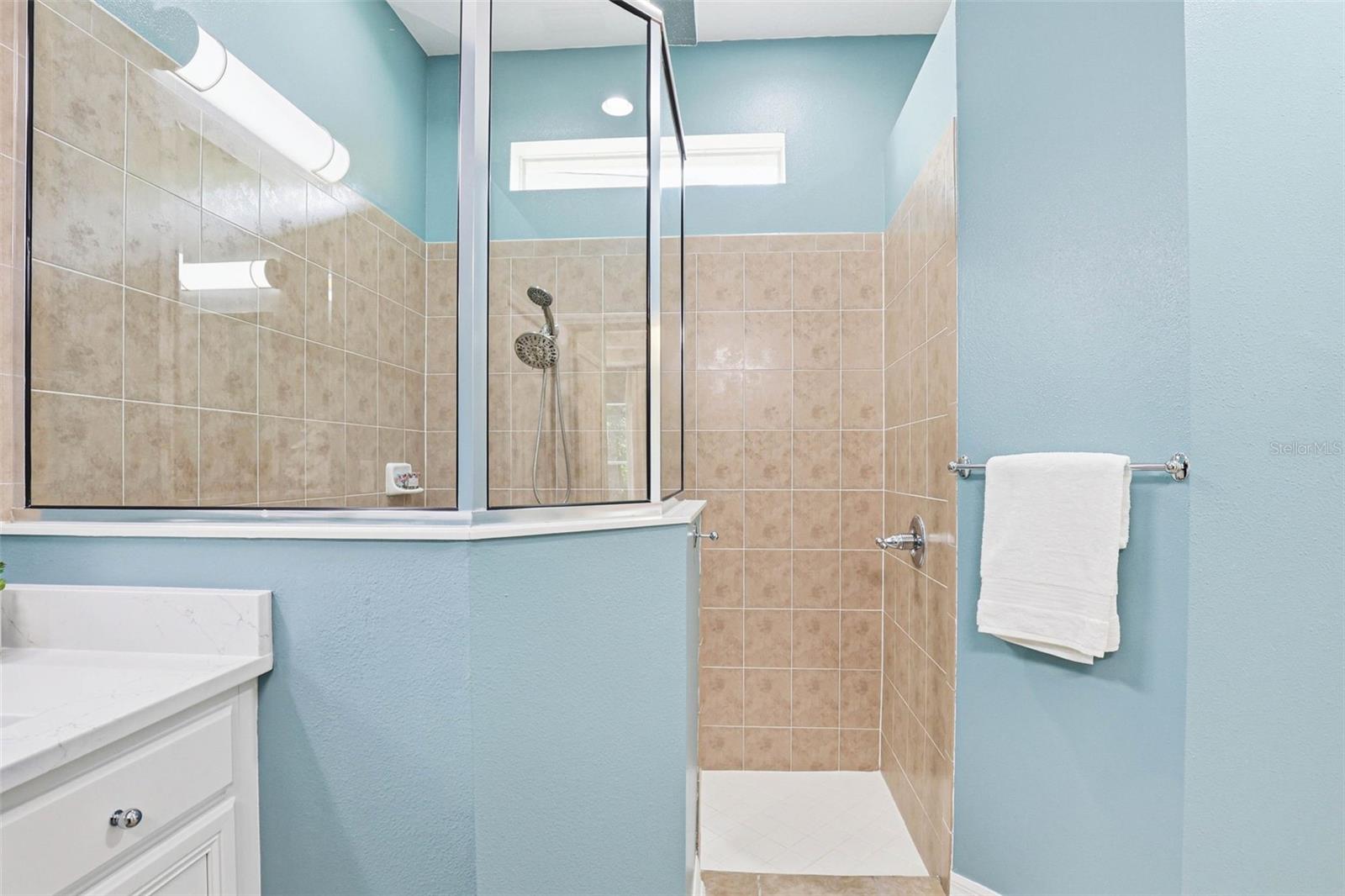 Primary En-Suite: Walk-In Glass Shower With Bench