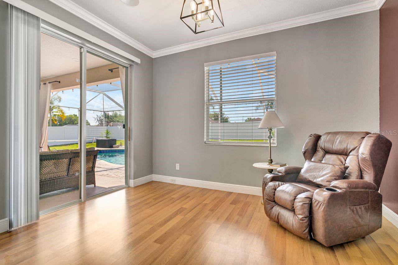 Primary Bedroom with Sitting Room/Flex Space and Sliding Glass Doors to Pool OASIS