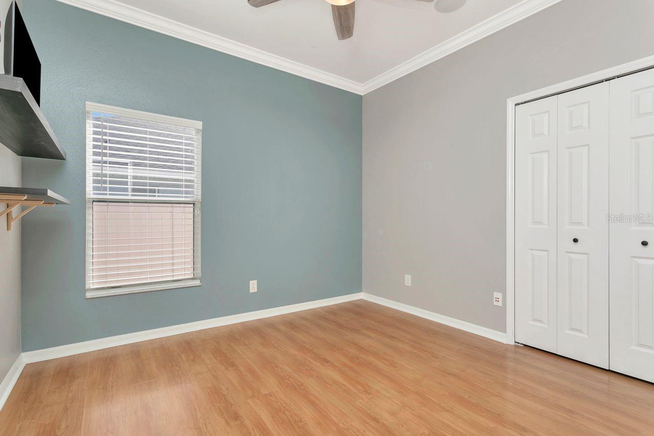 Bedroom #2 with LVP Floors, Ceiling Fan and Built-In Closet