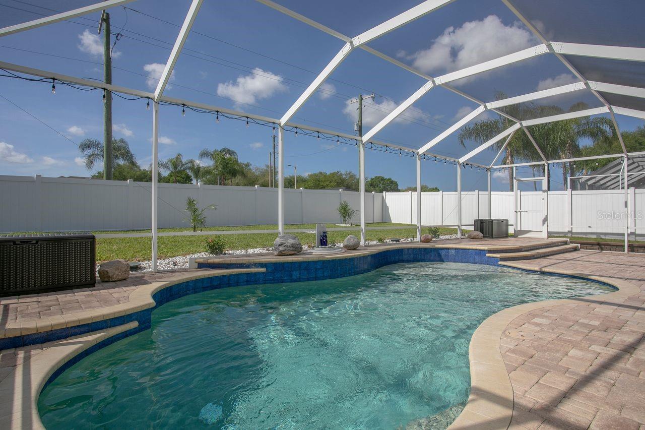 Heated Pool and Pool Cage with Pavered Deck