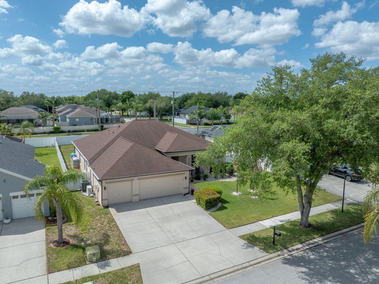 Aerial View of Home with Pool, Pool Cage, and Fully Fenced on a .25 Quarter Acre Lot