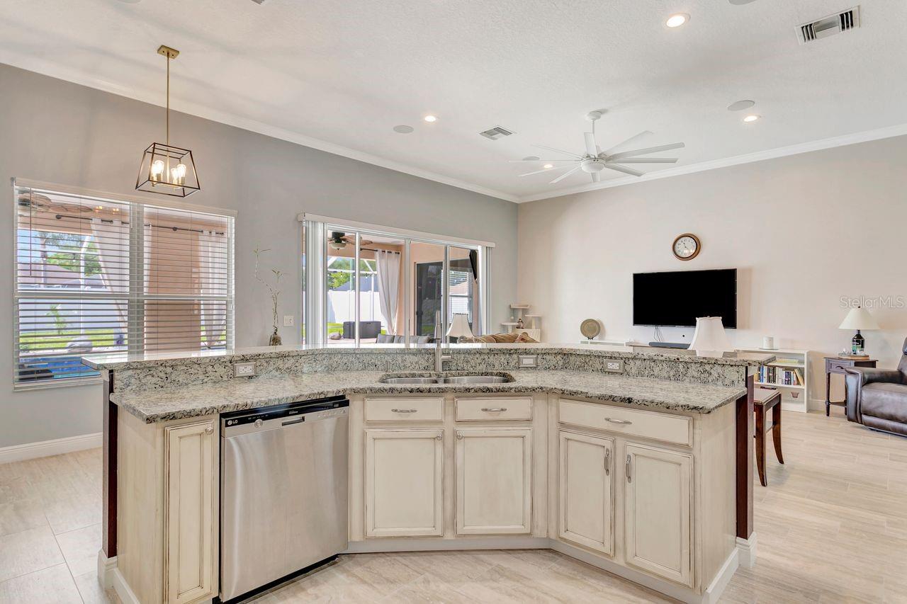 Kitchen Breakfast Bar and View of Eat-In Kitchen Space - Custom Cabinetry and Undermount Sink