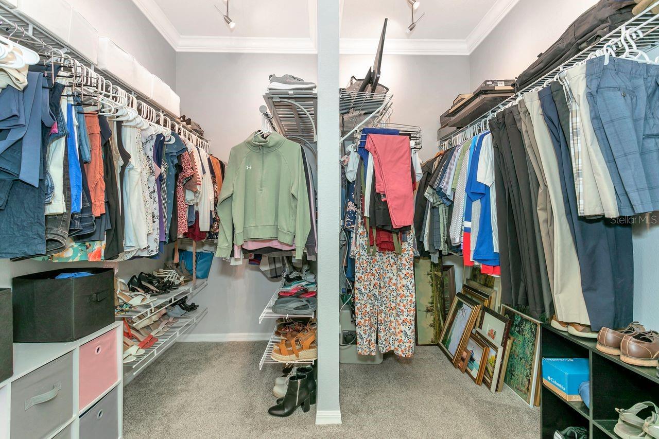 Primary Walk-In Closet with updated track lighting