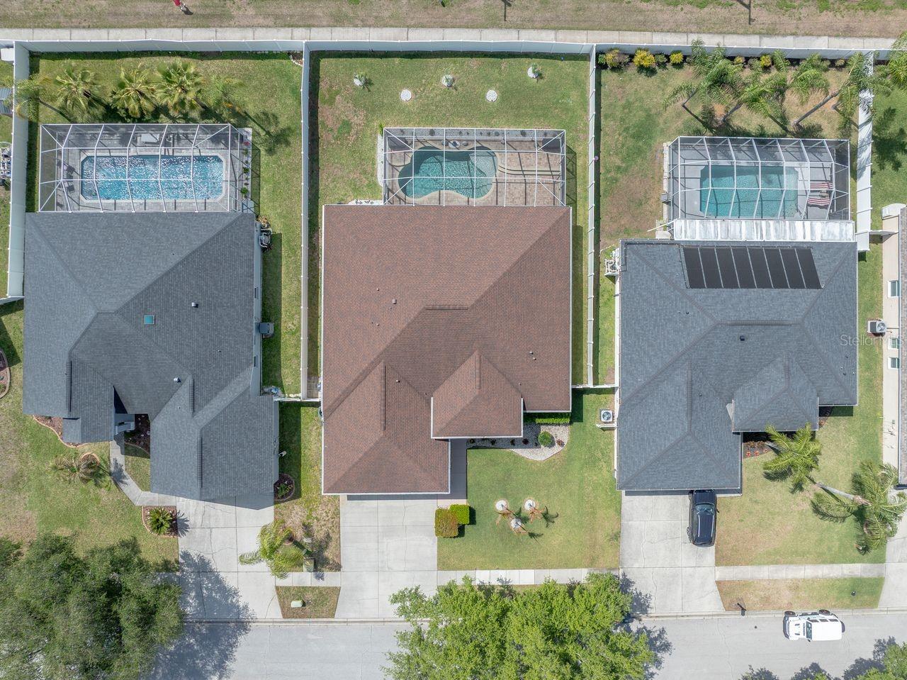 Aerial View of Home with Pool, Pool Cage, and Fully Fenced on a .25 Quarter Acre Lot