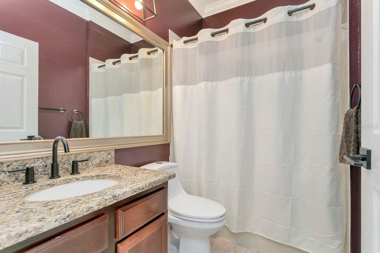 Upgraded Full Bathroom next to 2 Bedrooms with Shower & Tub and Granite Countertops