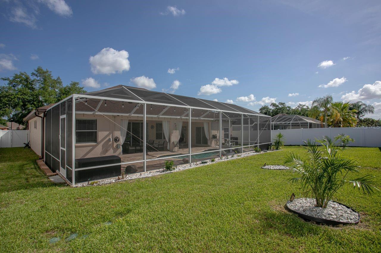 View of Back of Home, Pool, Decorative Landscaping