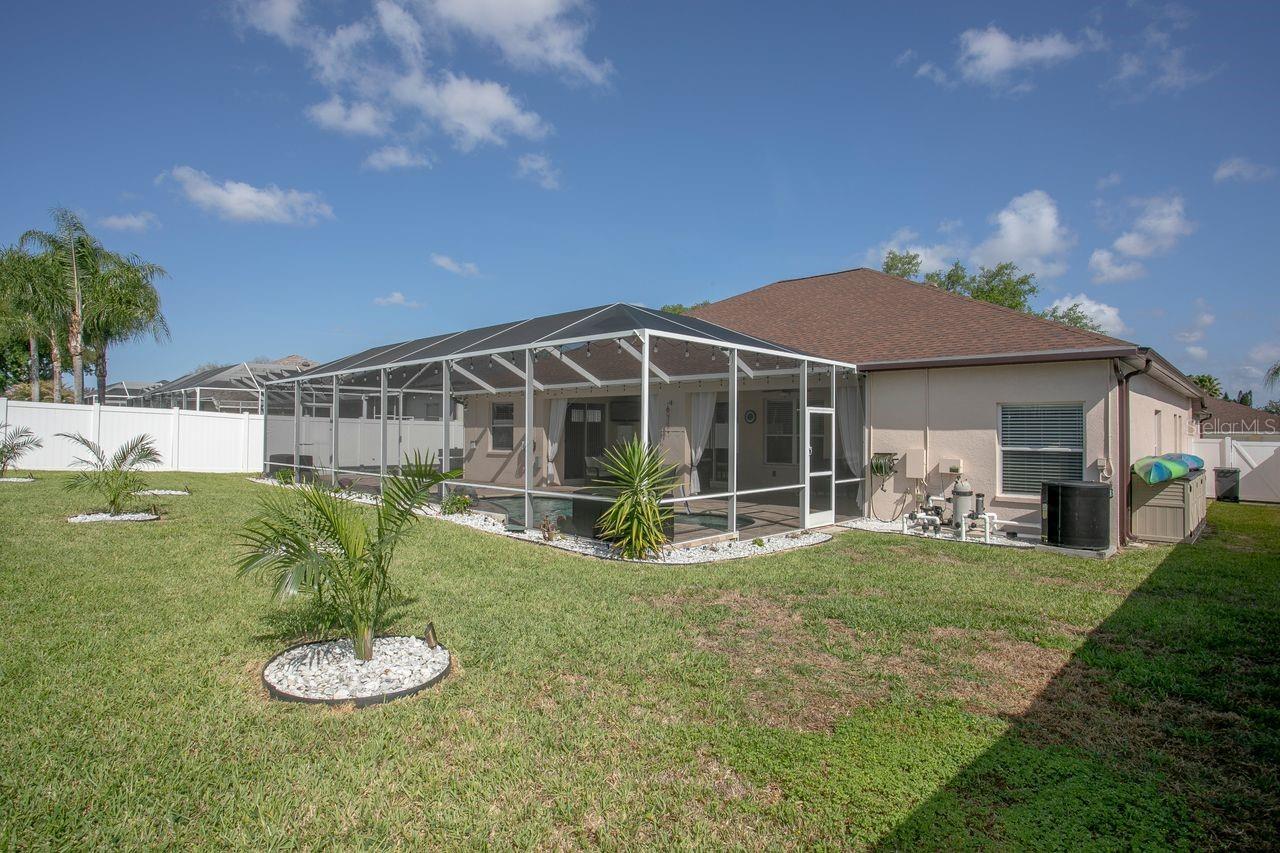 View of Back of Home, Pool, Decorative Landscaping