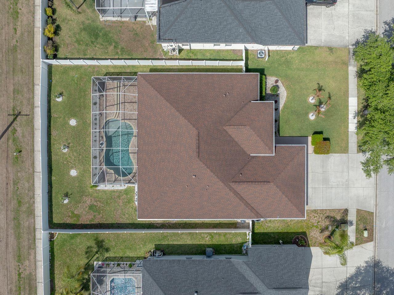 Aerial View of Home with Pool, Pool Cage, and Fully Fenced on a .25 Quarter Acre Lot Home