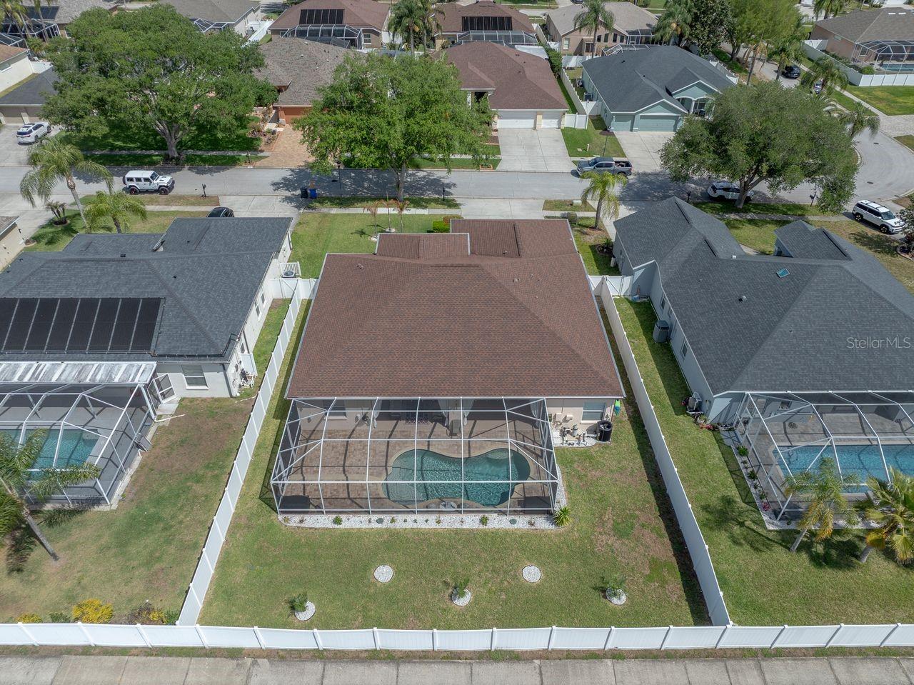 Aerial View of Home with Pool, Pool Cage, and Fully Fenced on a .25 Quarter Acre Lot