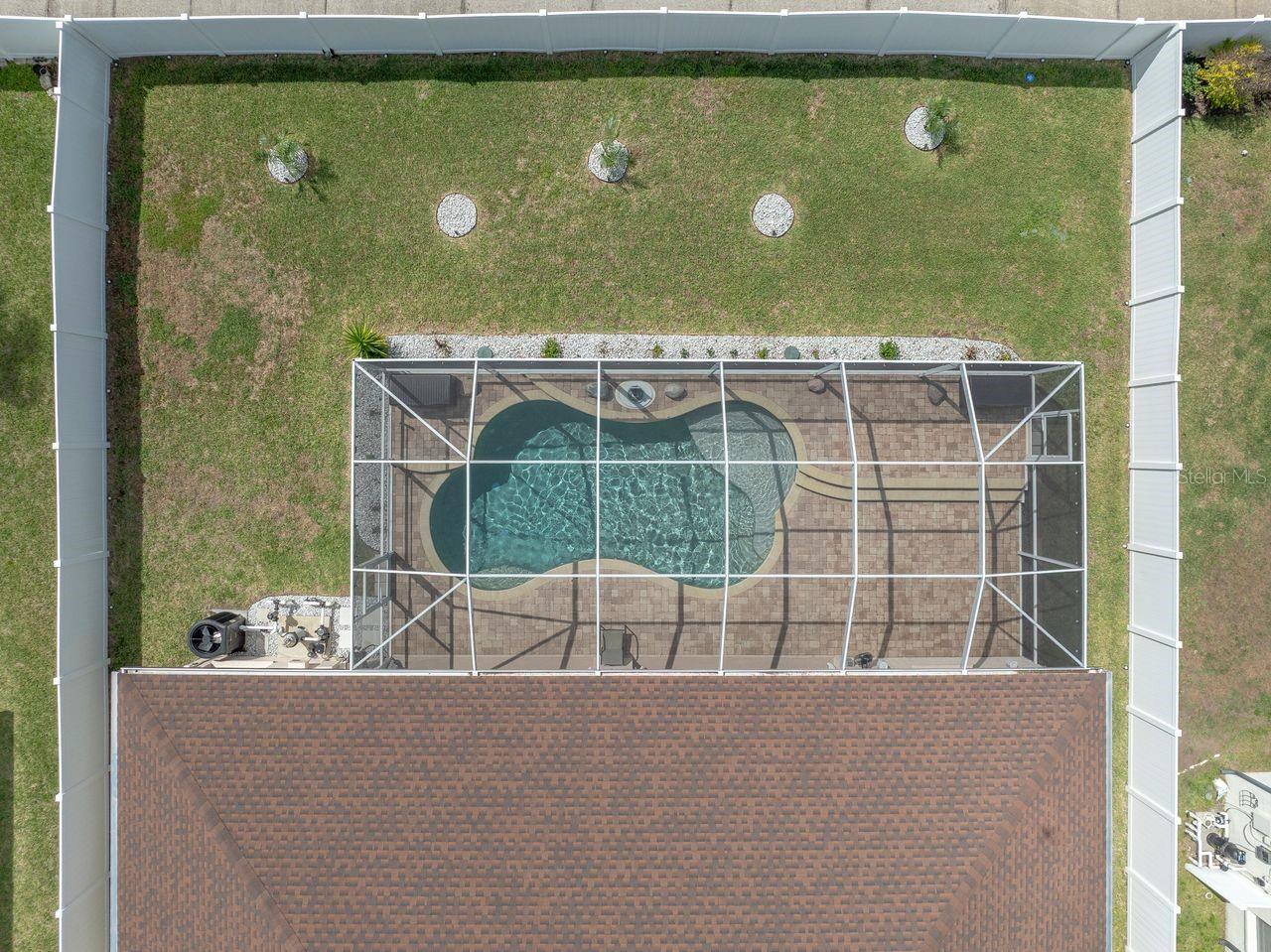 Aerial View of Home with Pool, Pool Cage, and Fully Fenced on a .25 Quarter Acre Lot