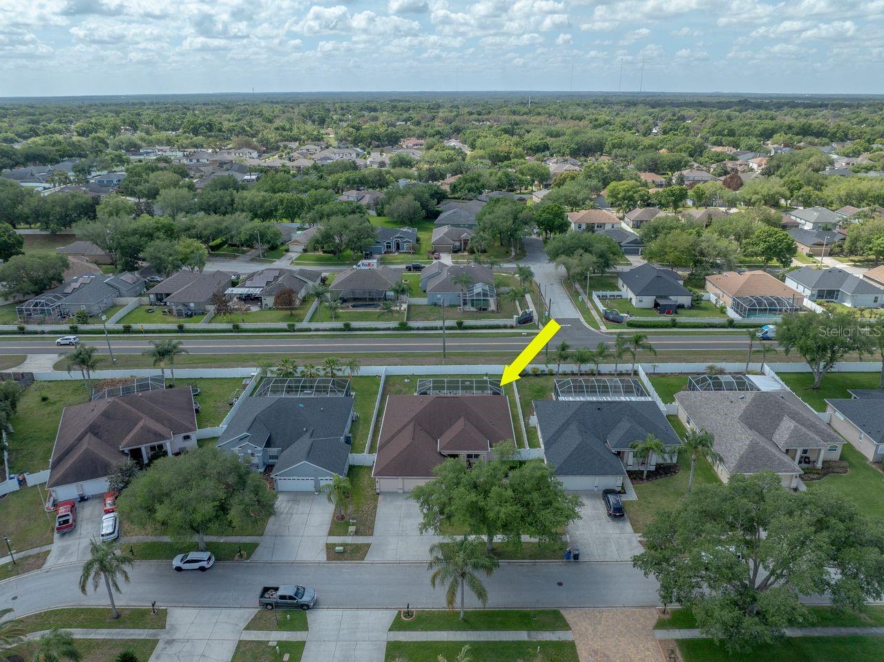 Aerial View of Home with Pool, Pool Cage, and Fully Fenced on a .25 Quarter Acre Lot