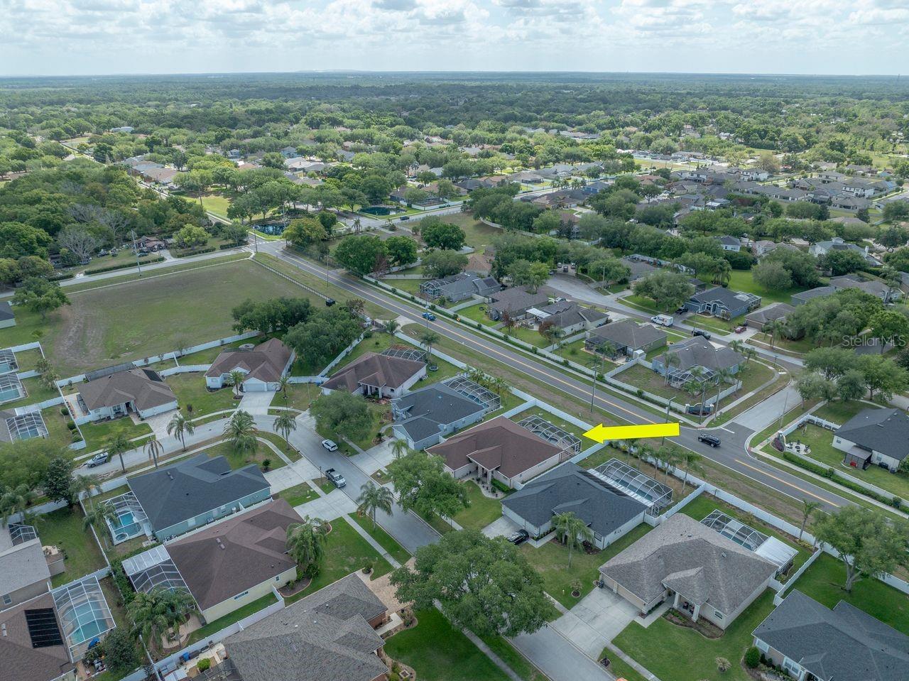Aerial View of Home with Pool, Pool Cage, and Fully Fenced on a .25 Quarter Acre Lot