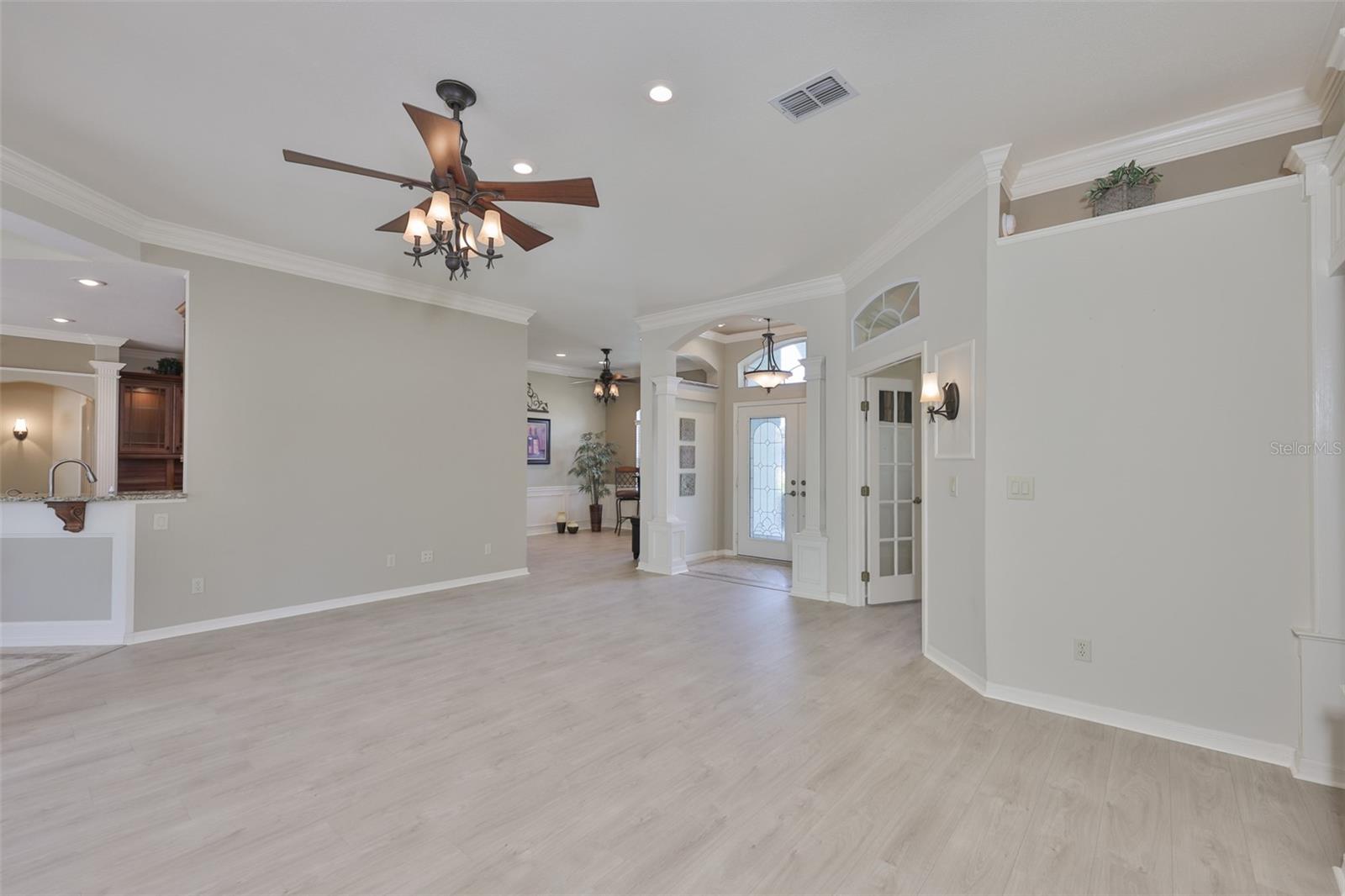 From the back sliding doors, you can see kitchen, den and dining rooms.