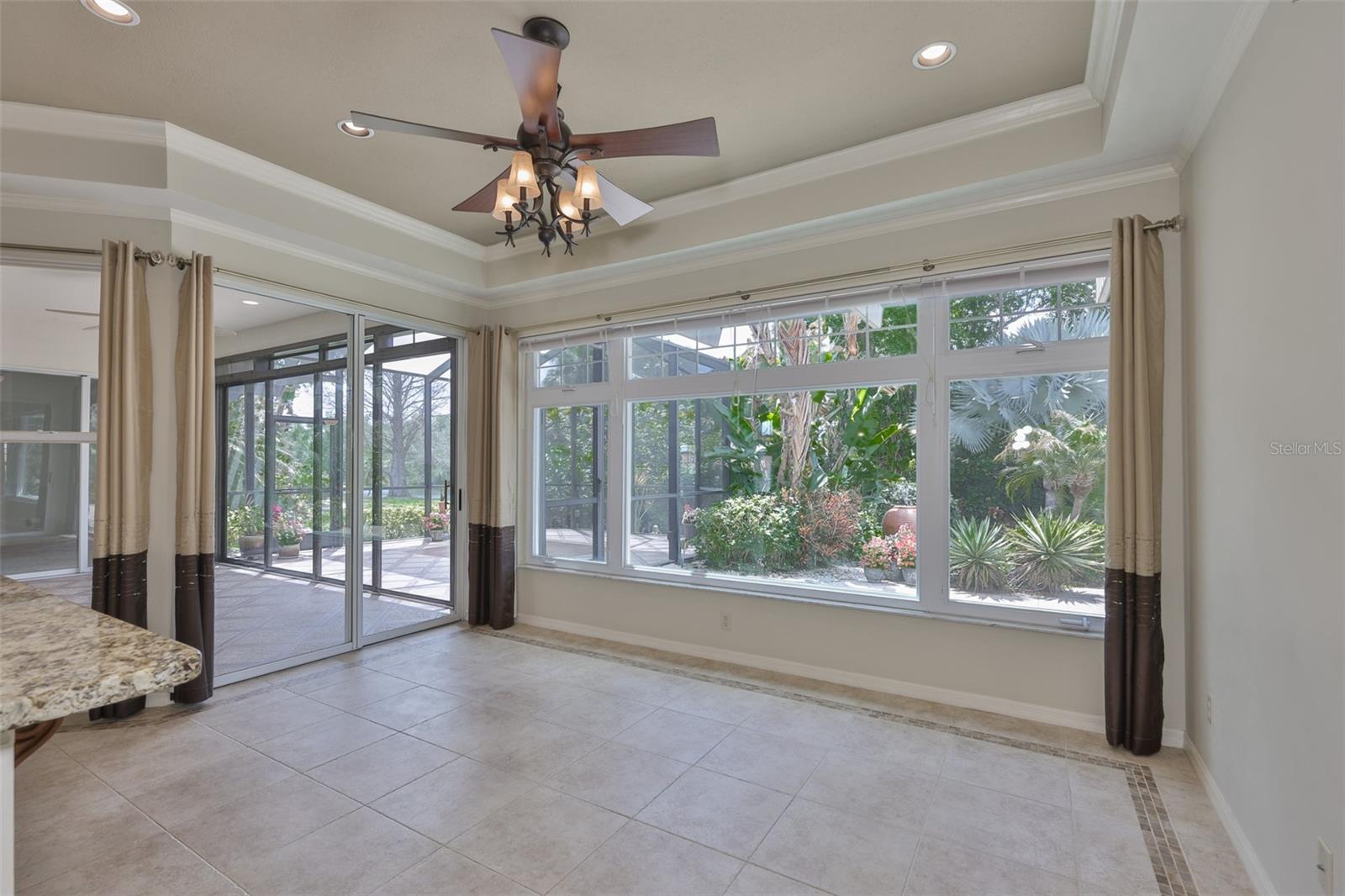 Breakfast room is perfect for enjoying every meal and appreciating all that mother nature has to offer through the large wall to wall windows.