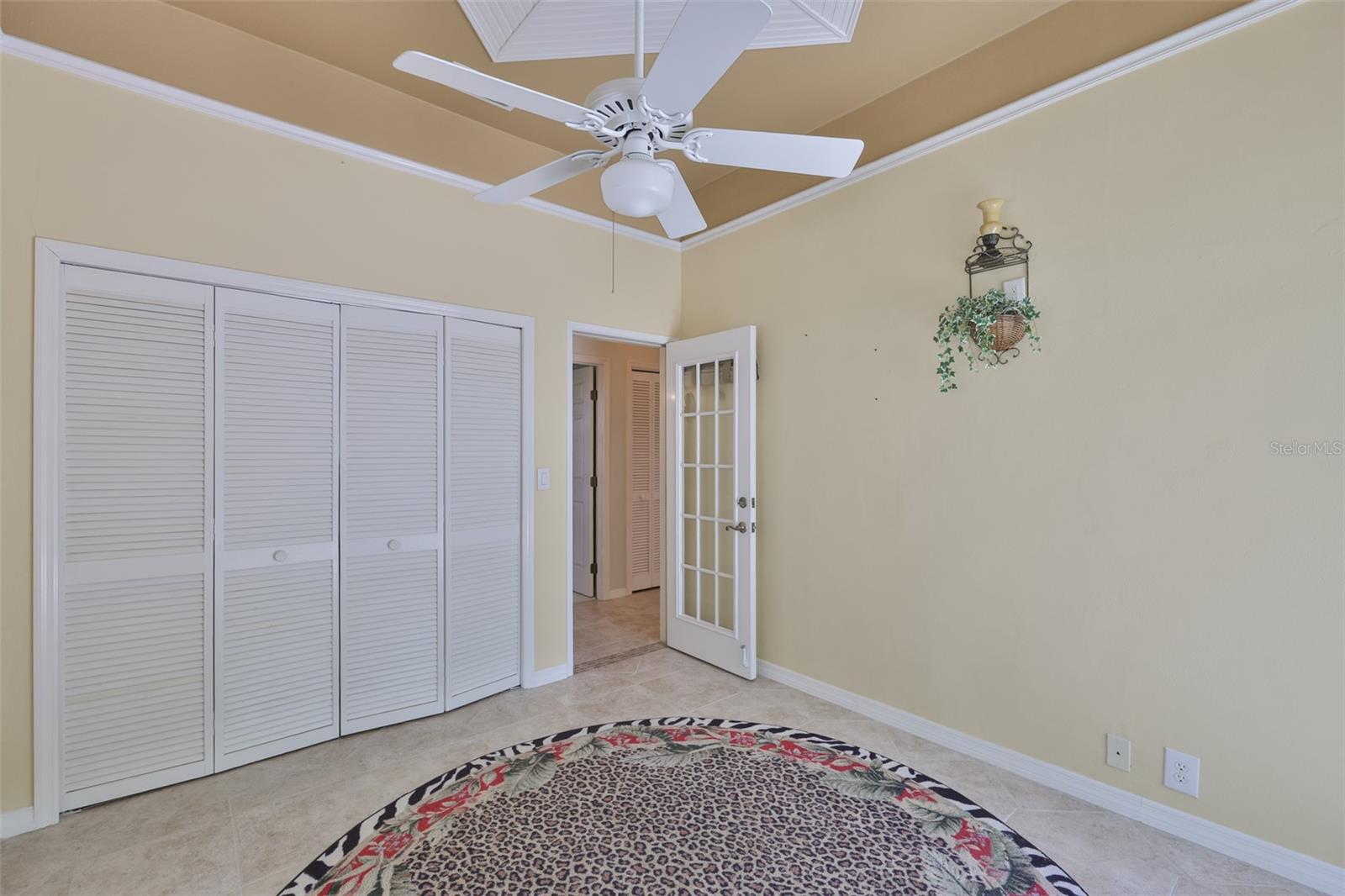 Large closet for storage and a glass paneled door makes this room extremely comfortable for a variety of uses.