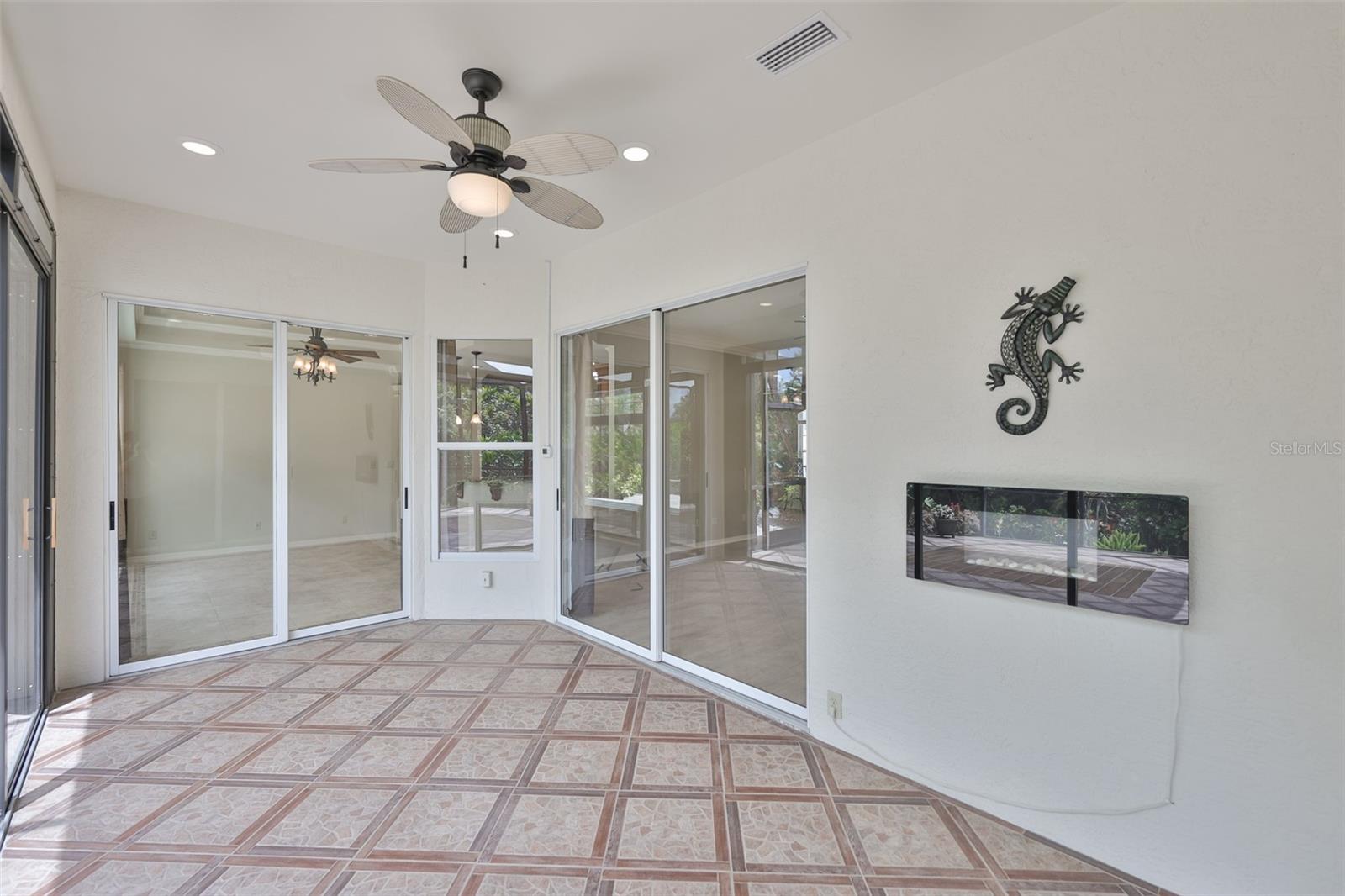 The Florida room is connected to the kitchen, great room and primary bedroom.  Fully tiled, SEPARATE THERMOSTAT, and an electric fireplace all add to the maximum enjoyment of this room year round.