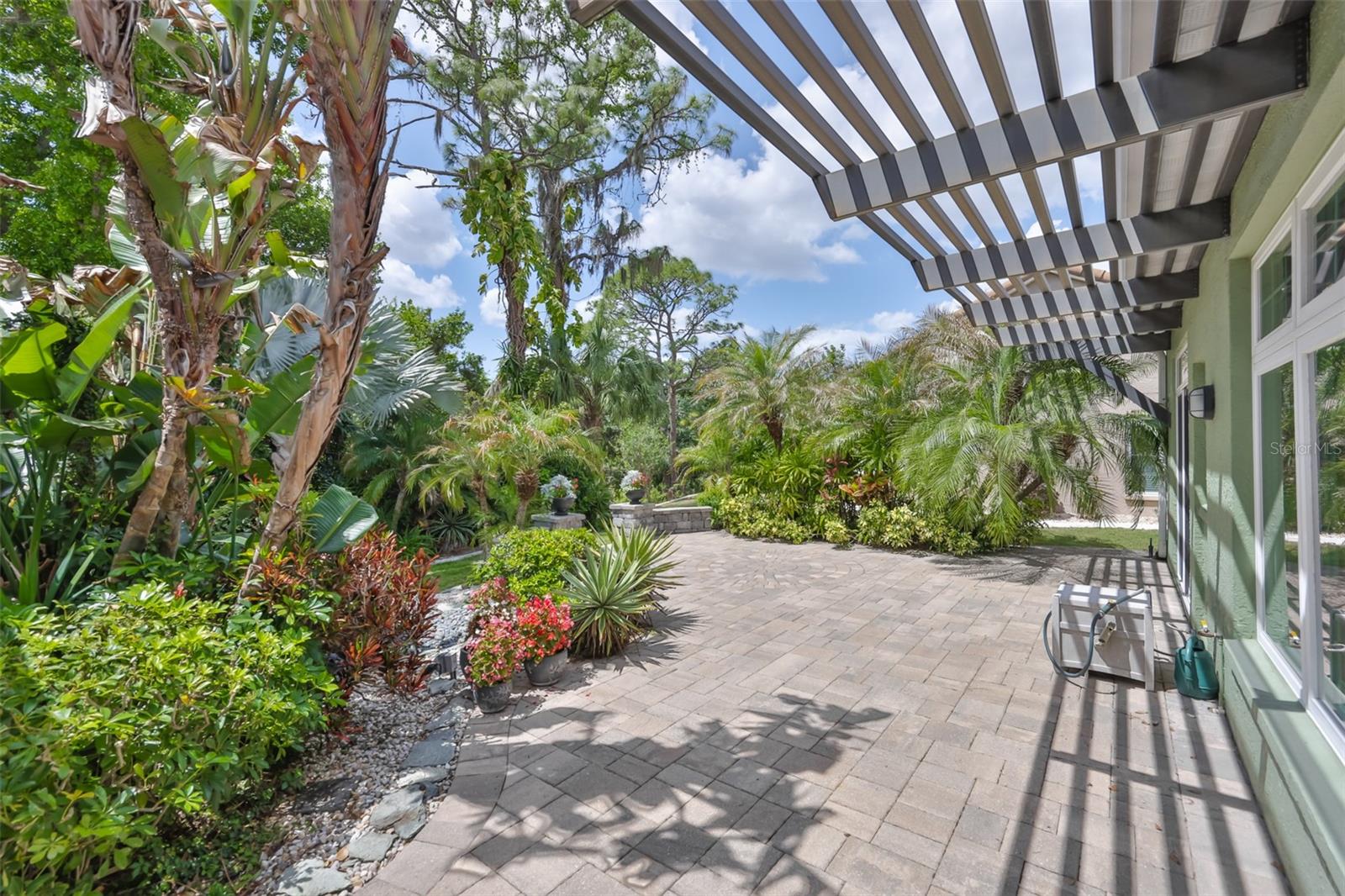 Beautifully landscaped, with a water fountain and easy maintenance plants, you have your own piece of paradise.