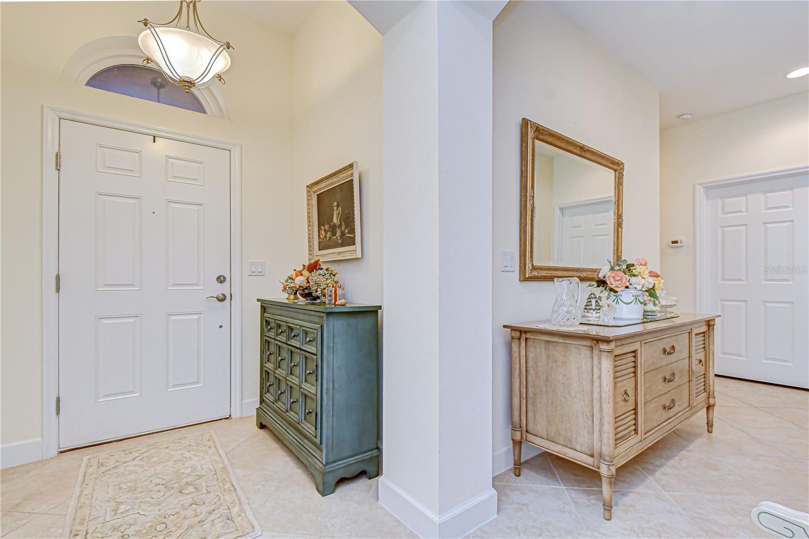 Welcoming entry showcasing open-concept design.