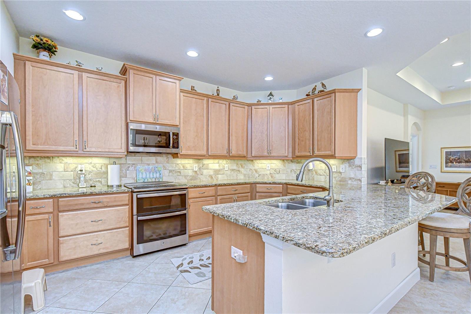 Rich wood cabinetry with ample storage.