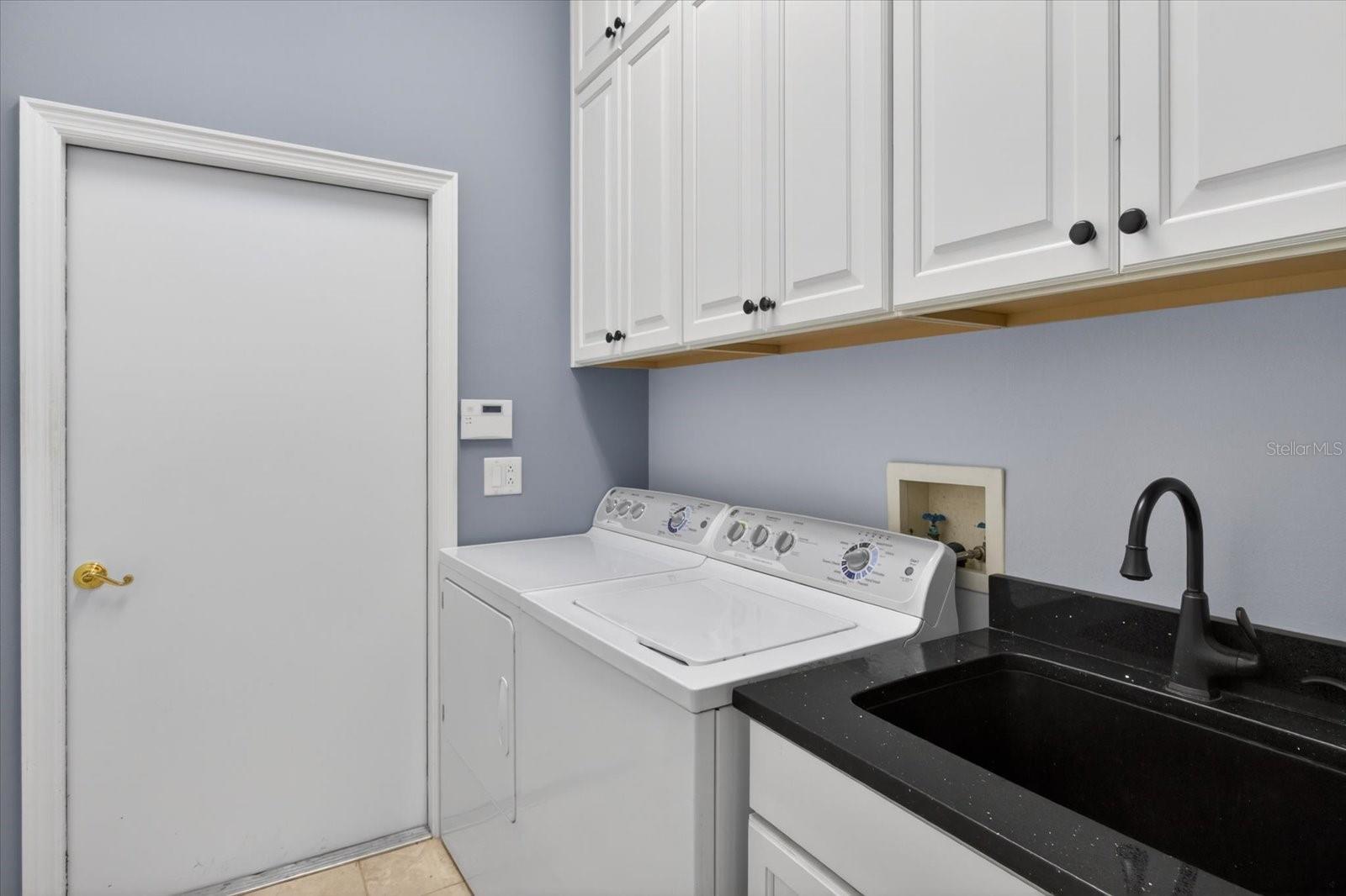 Laundry Room with tons of storage cabinets