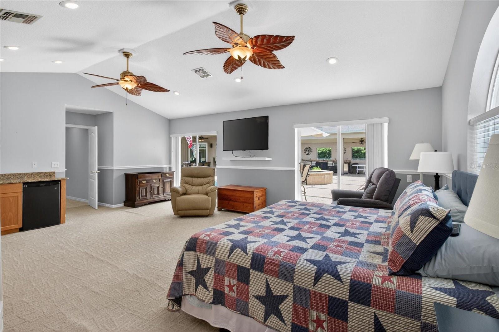 Bonus Room-2 sets of sliding glass doors and mini fridge and Bar area