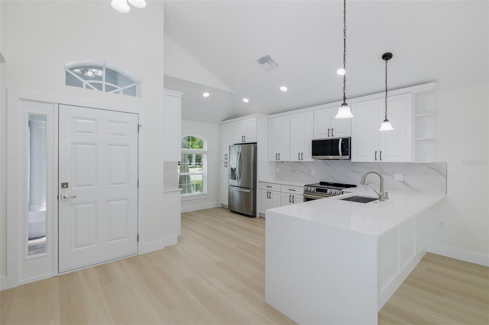 Kitchen with Waterfall Quartz Breakfast Bar