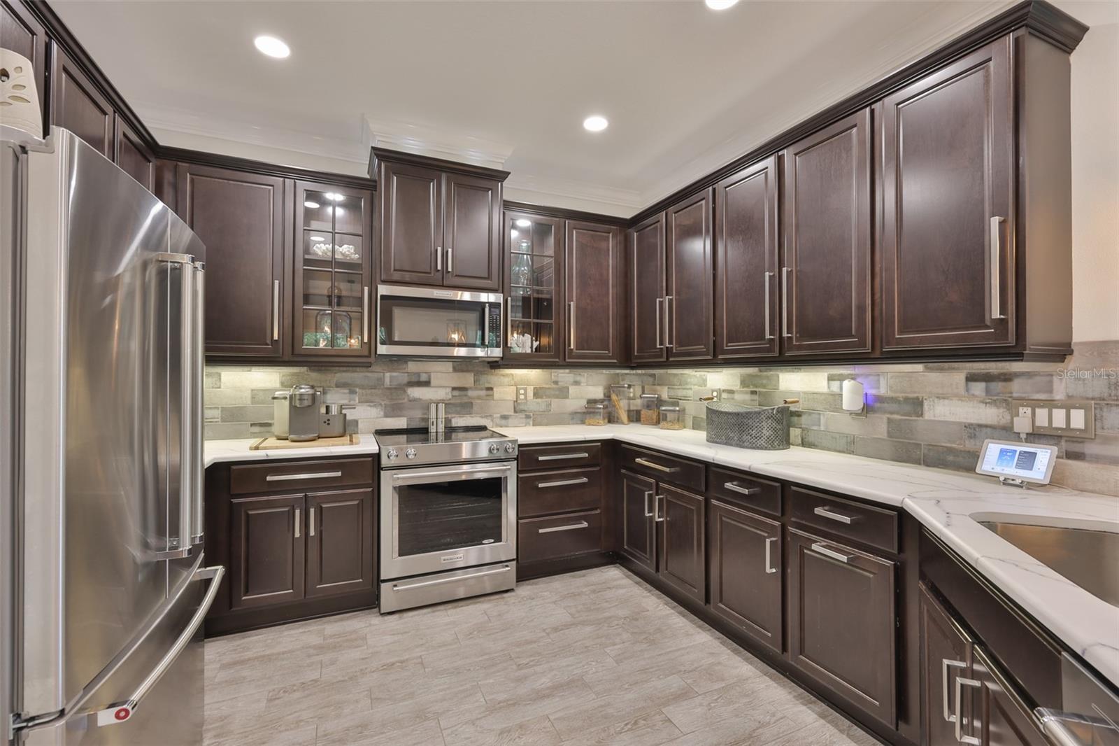 A spectacular kitchen with high end appliances, remote controlled variable lighting functions and all wood cabinets.