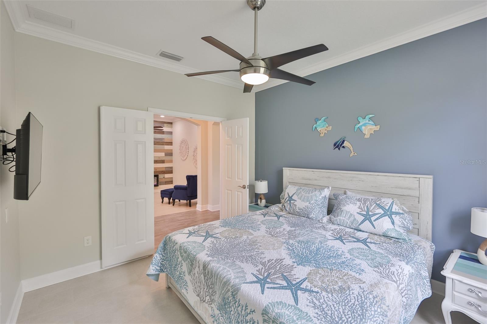 Crown molding continues and with a fan and TV, it is ready for guests.