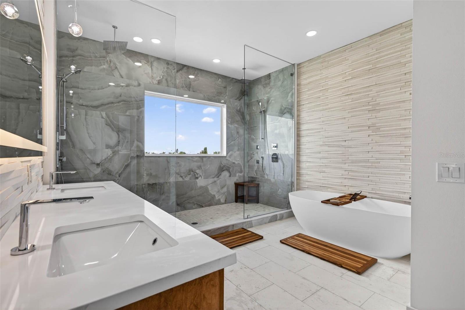dual vanity with soaking tub and dual rain head showers