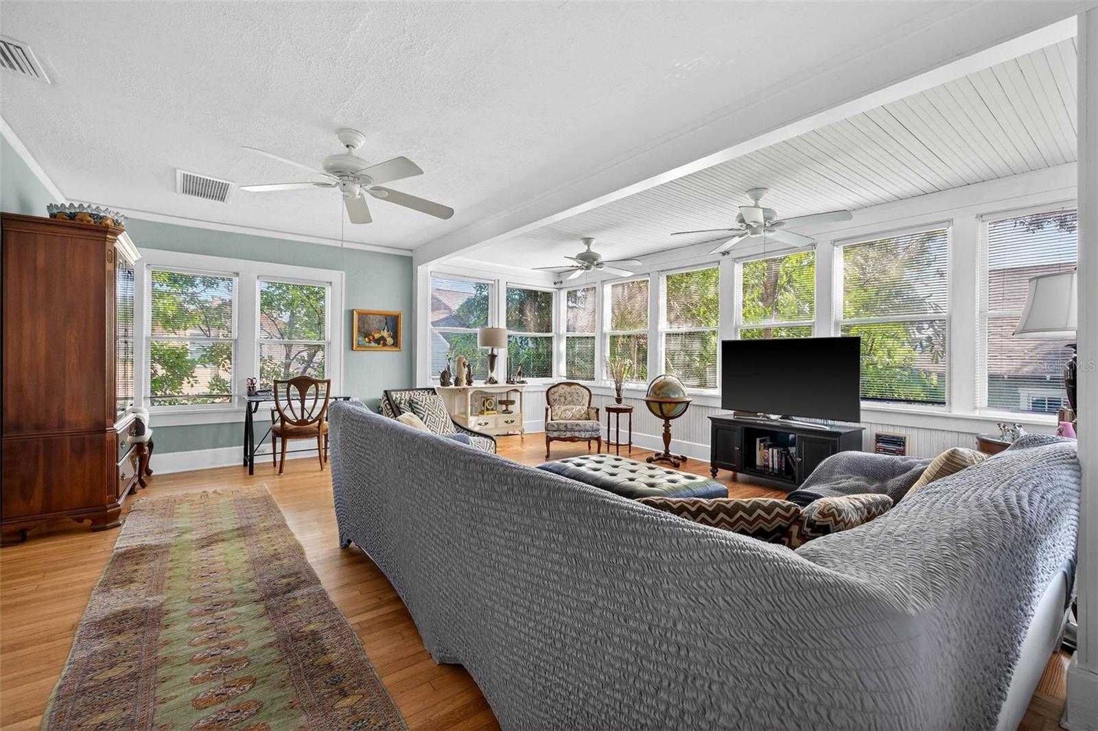 Sun-Drenched Family Room Featuring a Wall of Windows