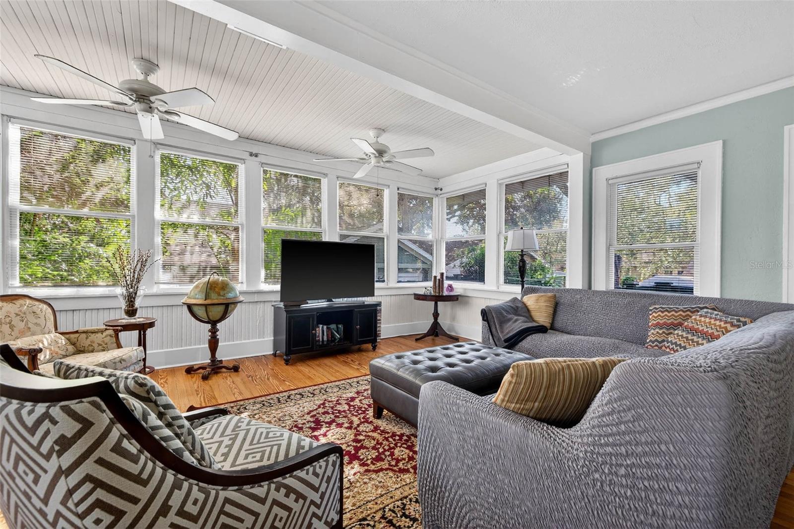 White Beadboard Ceilings & Hardwood Floors