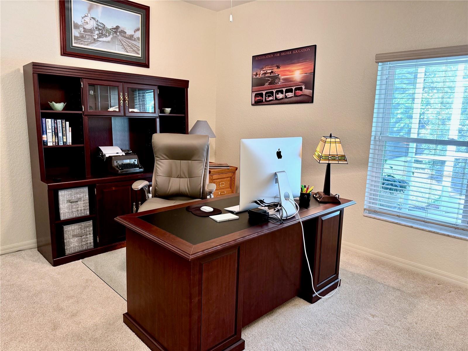 Back bedroom was being used as office with view of pool