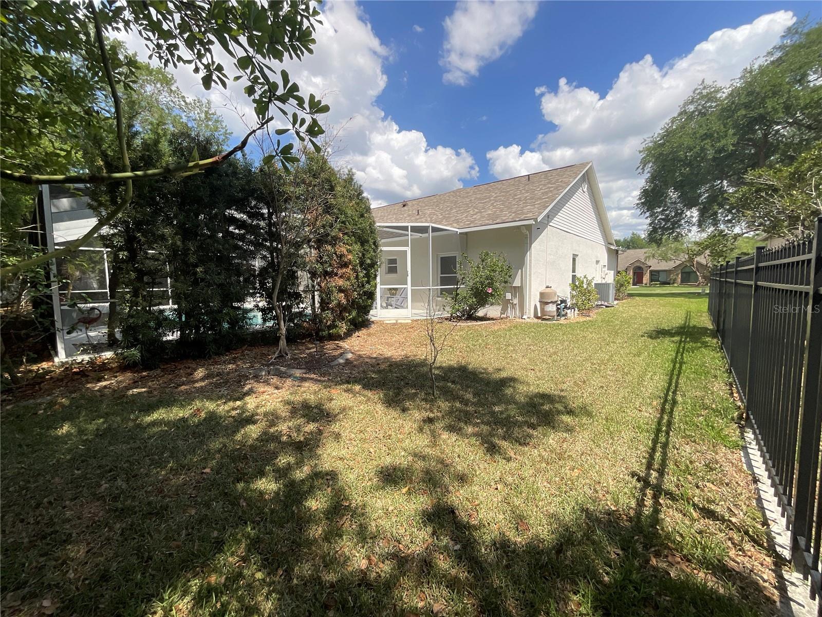 View facing pool from back left corner of property.