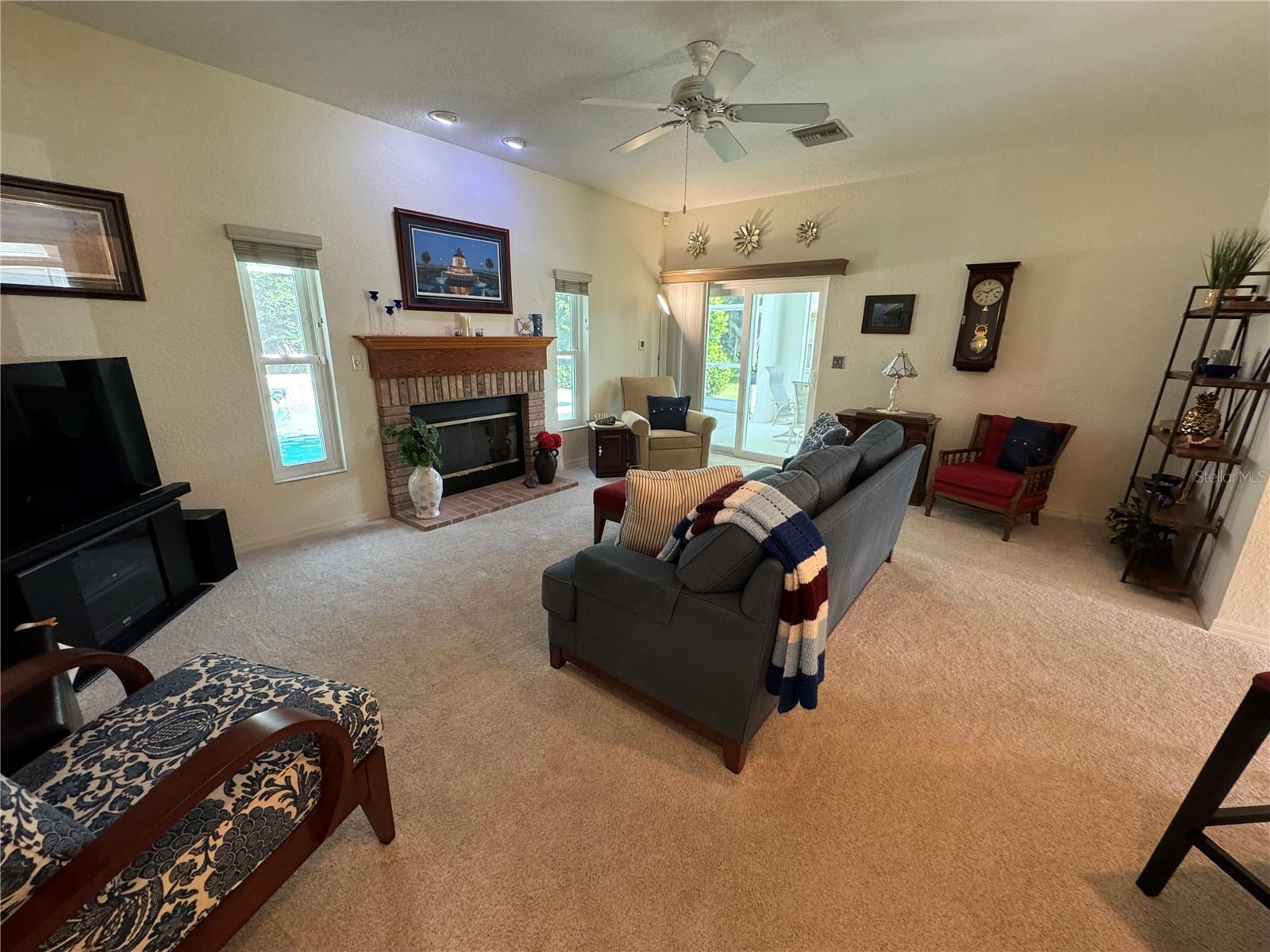 Living room with wood burning fireplace