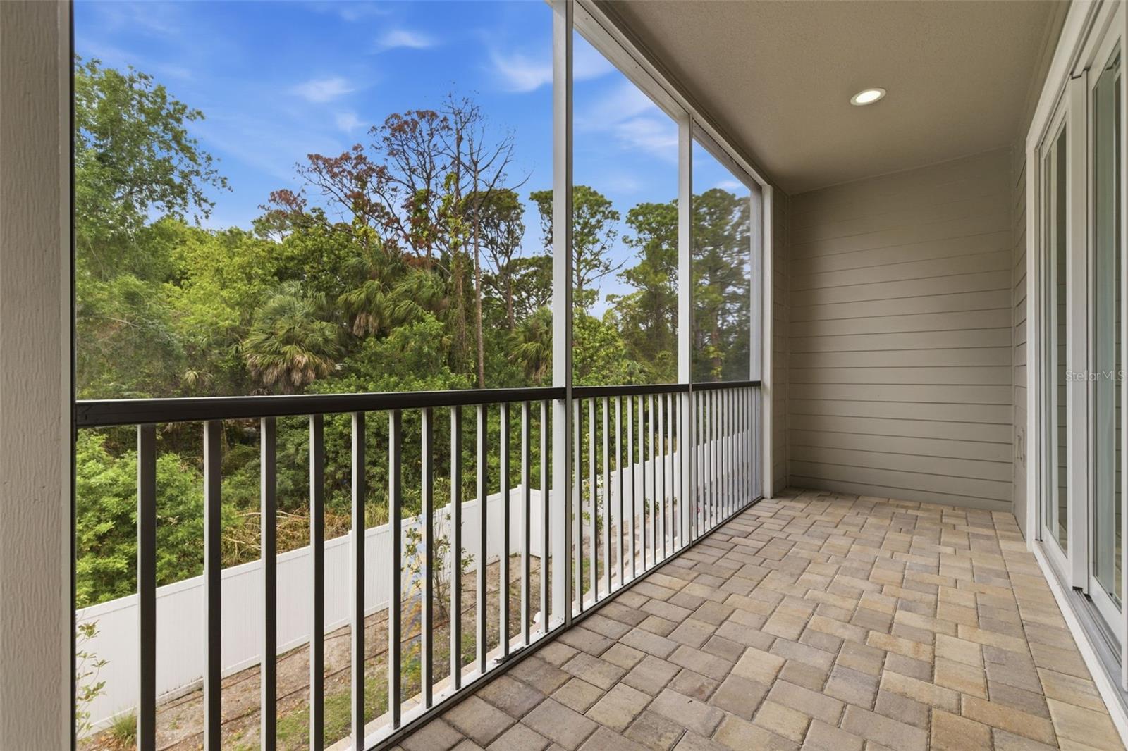 Screened, covered balcony off living room