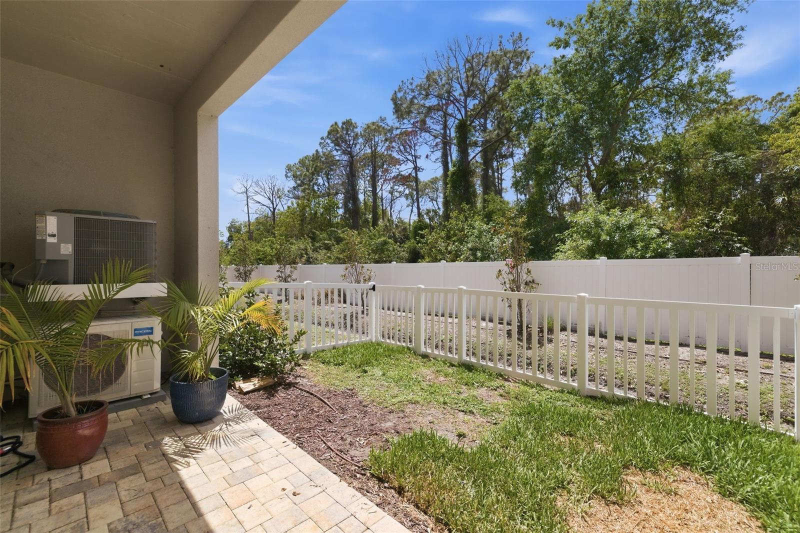 Covered back patio and fenced yard.