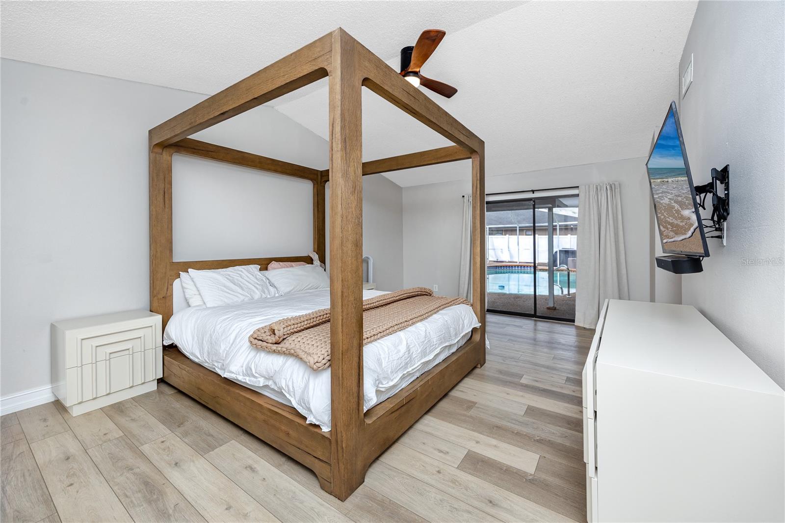 Owner's ensuite with double walk in closets, two additional closets, and a full bath. Access to the lanai too!